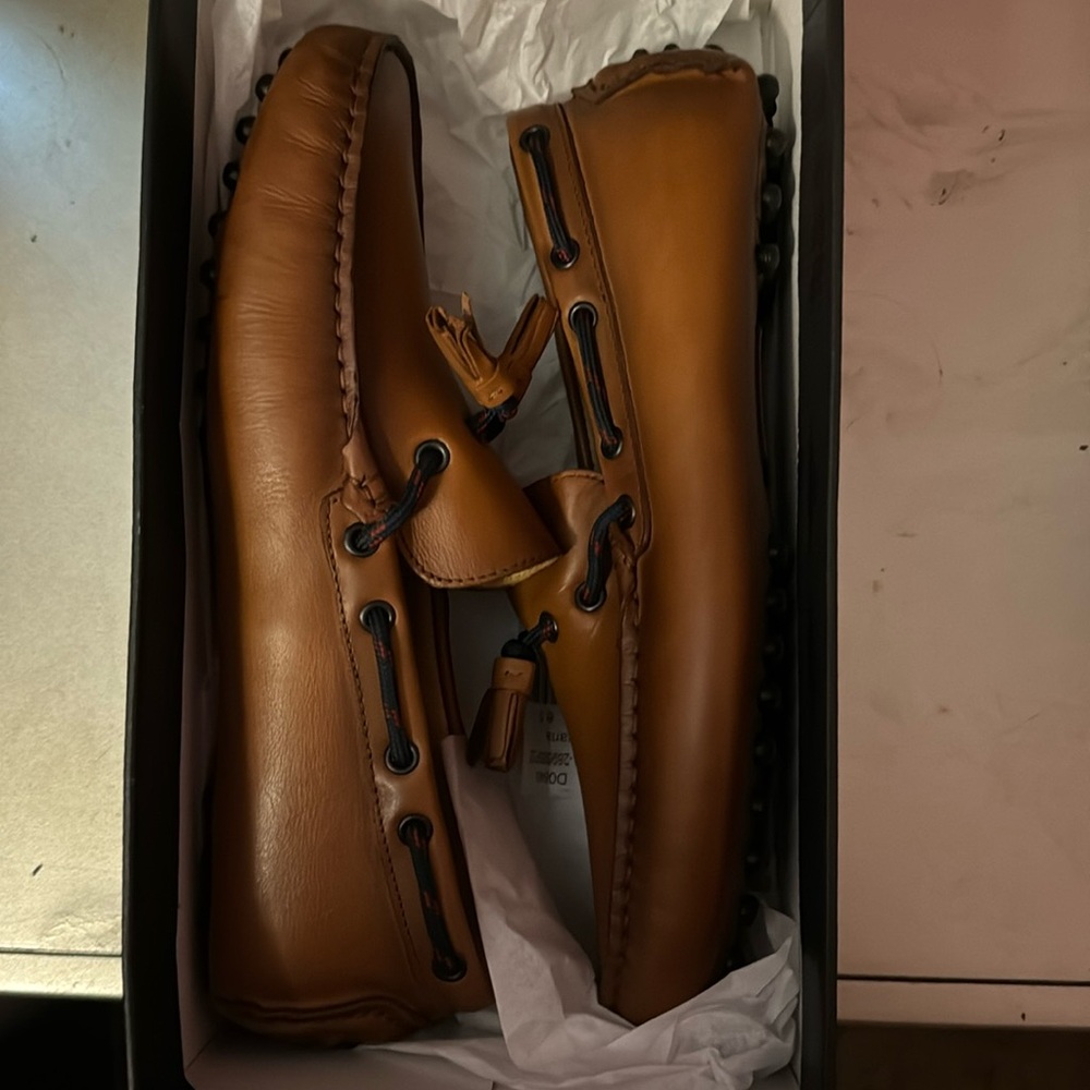 Brown Saks loafers size 8.5. They run a little big.